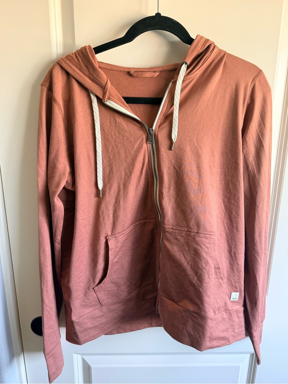 Vuori Halo Performance Hoodie 2.0 in a salmon color